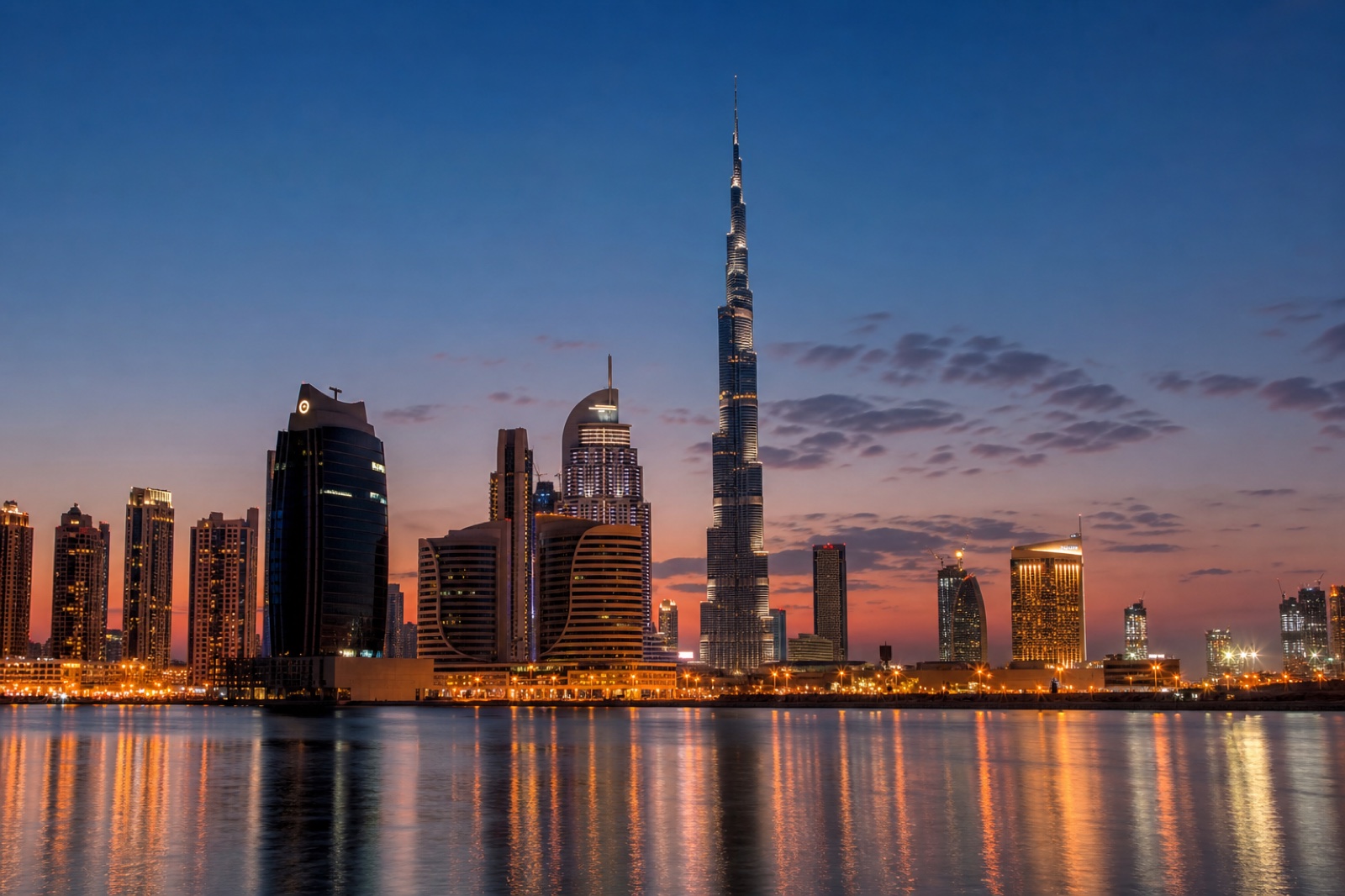 Dubai skyline and Burj Khalifa reflected across the water